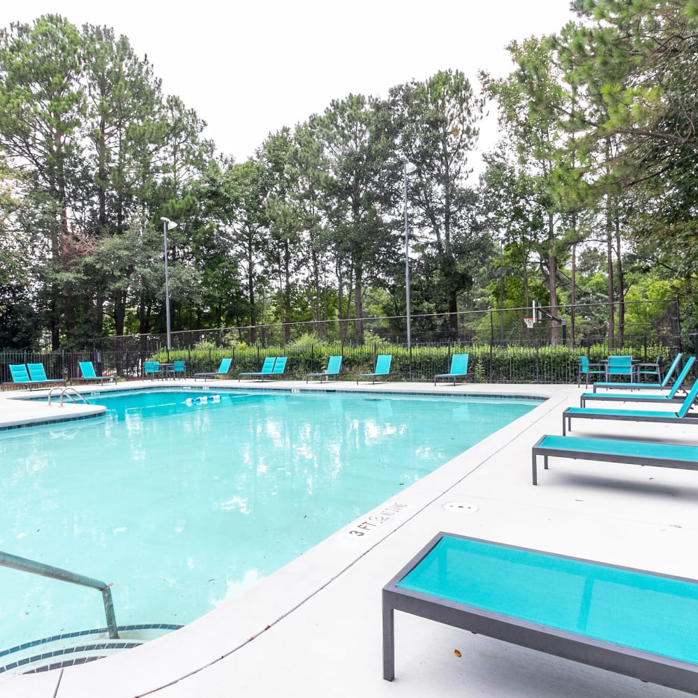 A pool with plenty of lounge chairs at Cumberland Crossing in Marietta, Georgia
