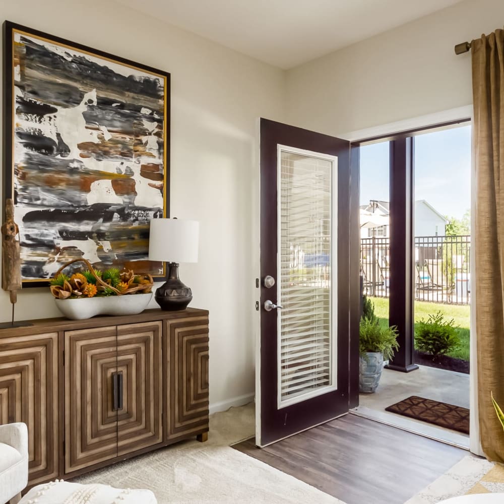 Model living space leading to an exterior patio at Overland Park in Pickerington, Ohio