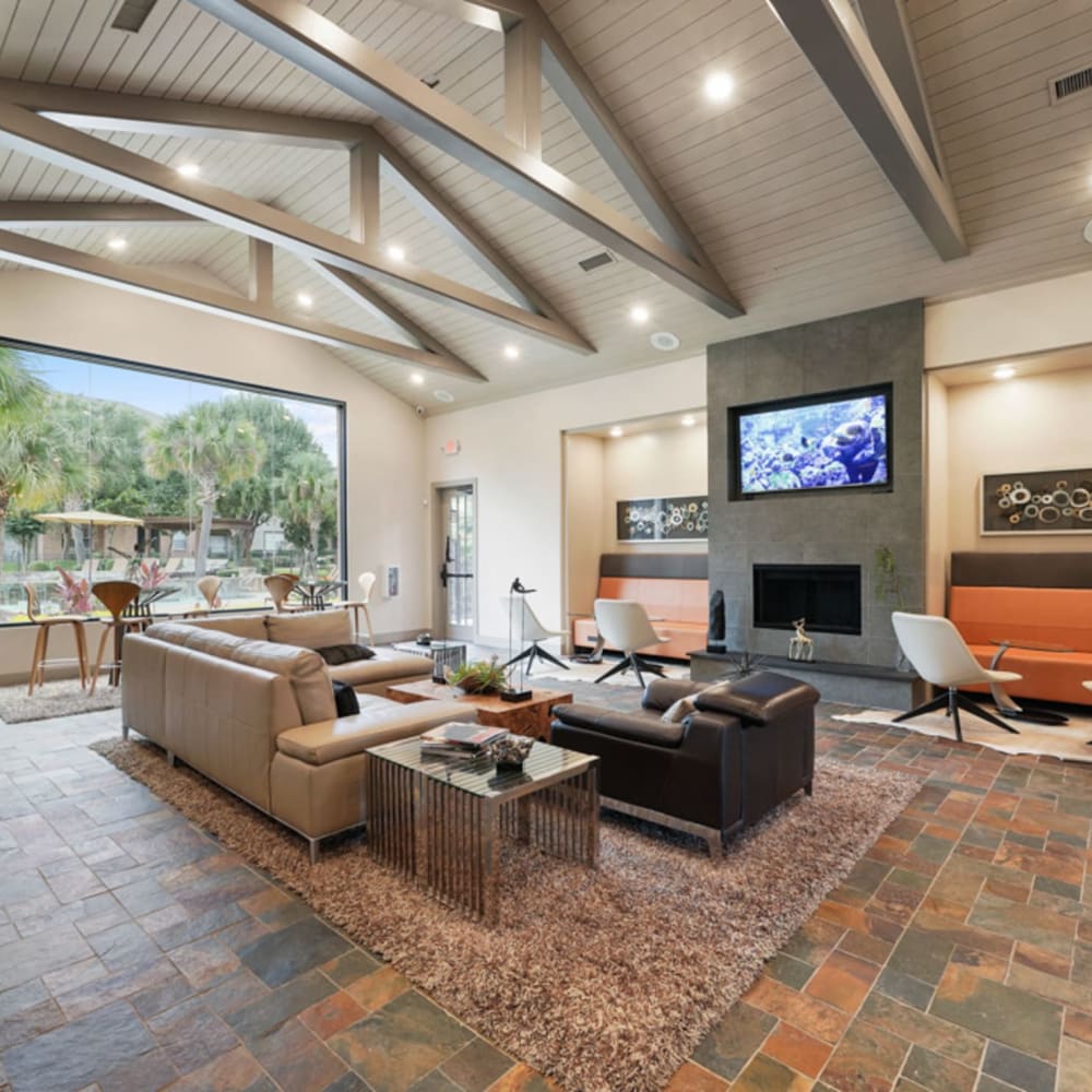 Clubhouse with lounge and TV at River Pointe in Conroe, Texas