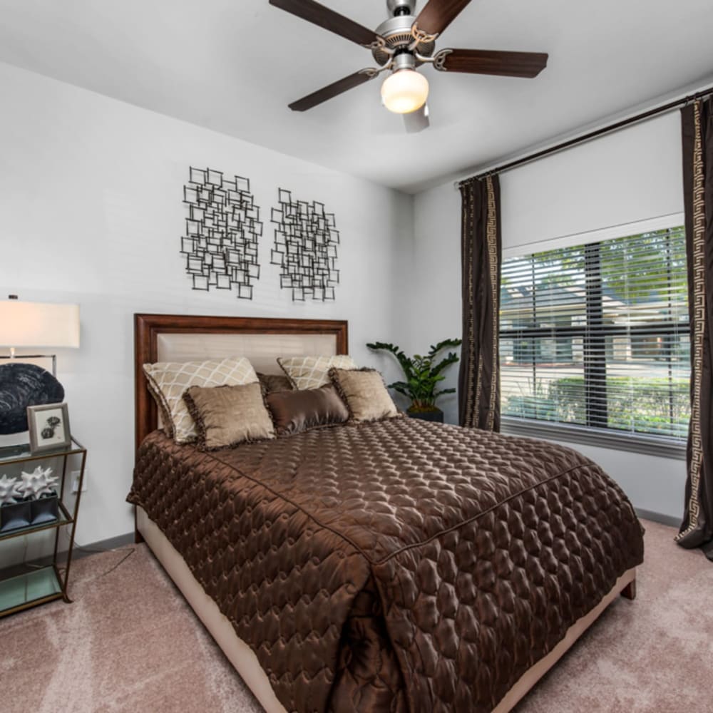 Model well furnished bedroom at Avenues at Tuscan Lakes, League City, Texas