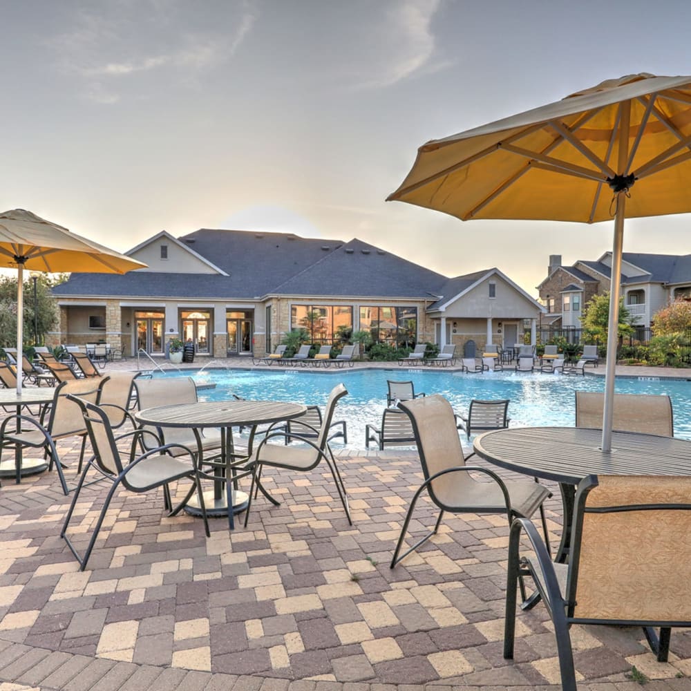 Pool with chairs at Waterstone at Cinco Ranch in Katy, Texas