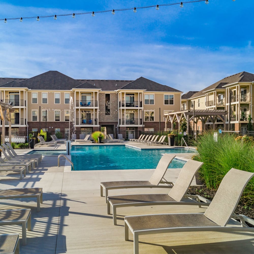 Style Swimming Pool with pool chairs at The Greyson in Hilliard, Ohio