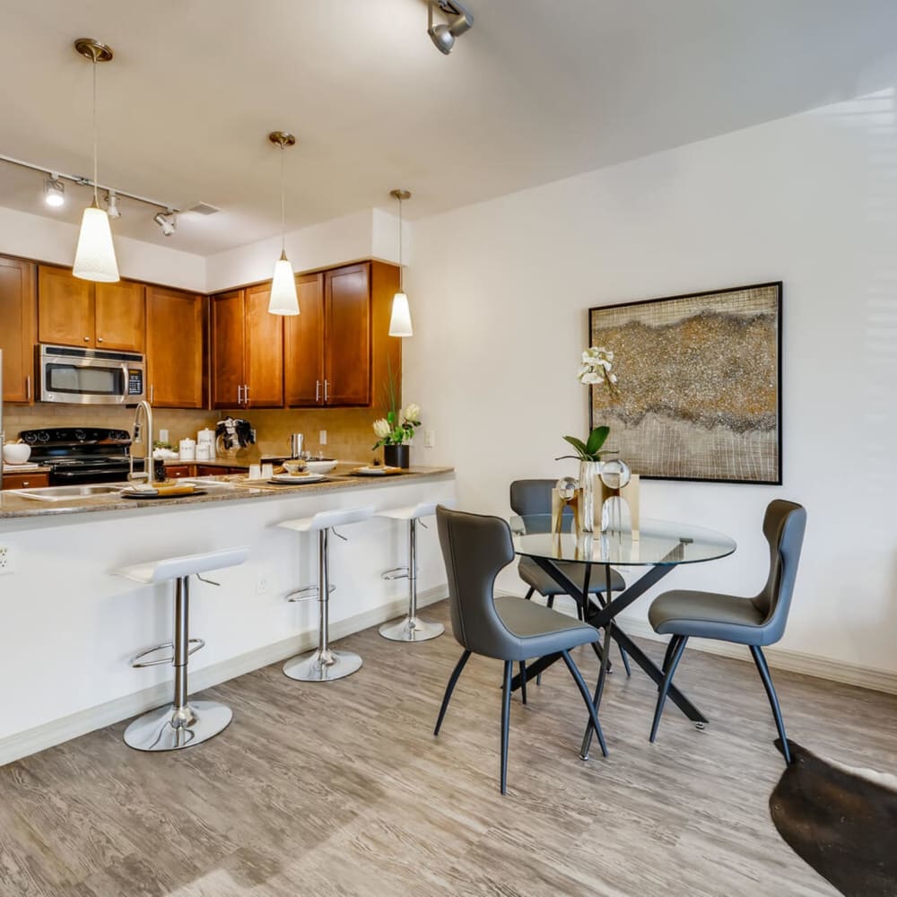 Kitchen with dining table at Discovery at Craig Ranch in McKinney, Texas