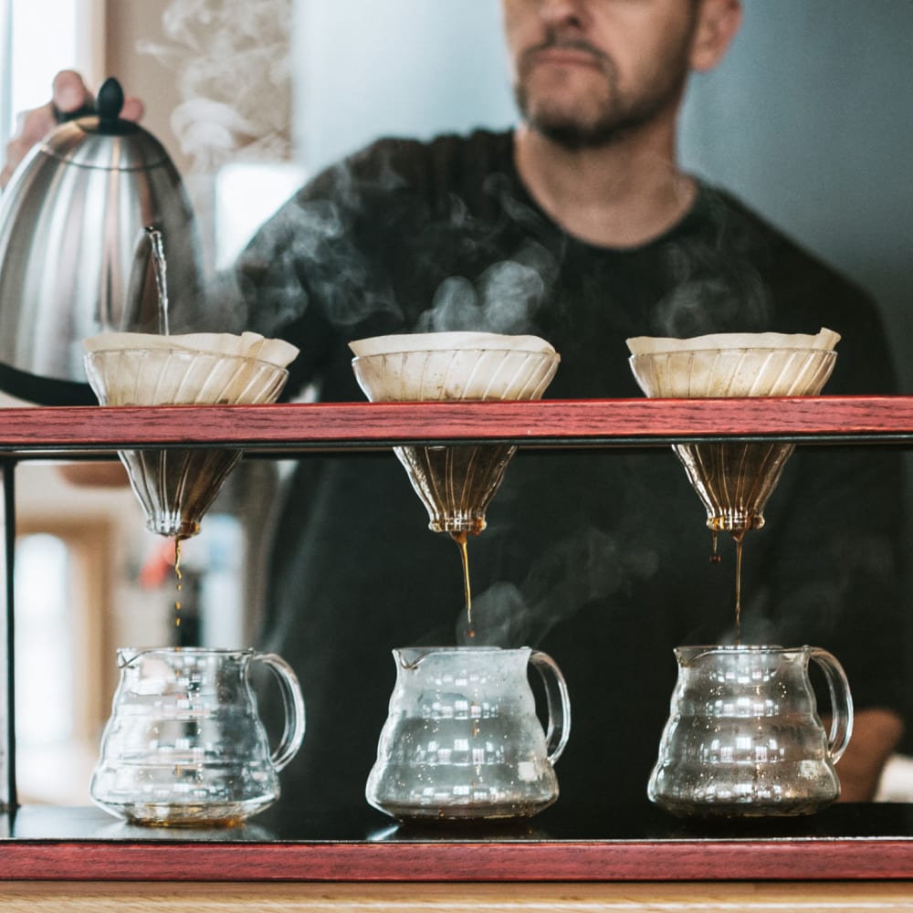 Barista making some drip coffee at work near The Ivy in Tampa, Florida