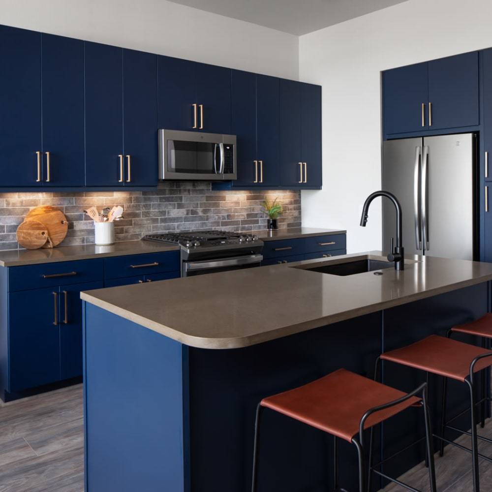 Kitchen with under cabinet lights at Bellrock Sawyer Yards in Houston, Texas