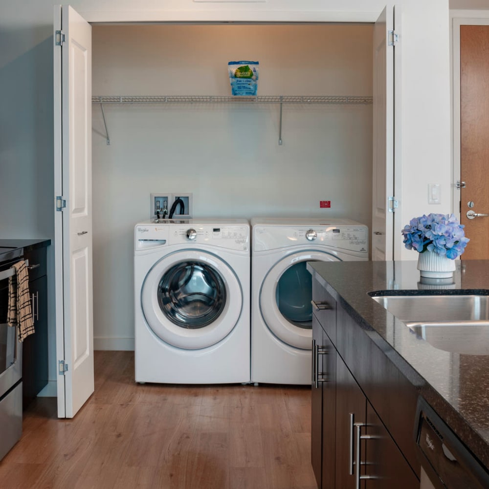 Full-size in-home washer and dryer in a model home's kitchen at CitiTower in Orlando, Florida