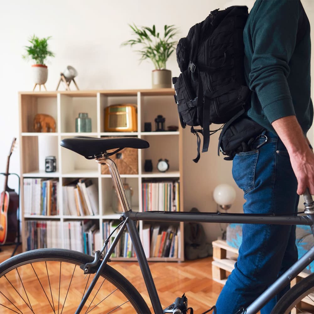 Resident walking his bike out of his apartment home and heading to work near Mission Rock at Novato in Novato, California