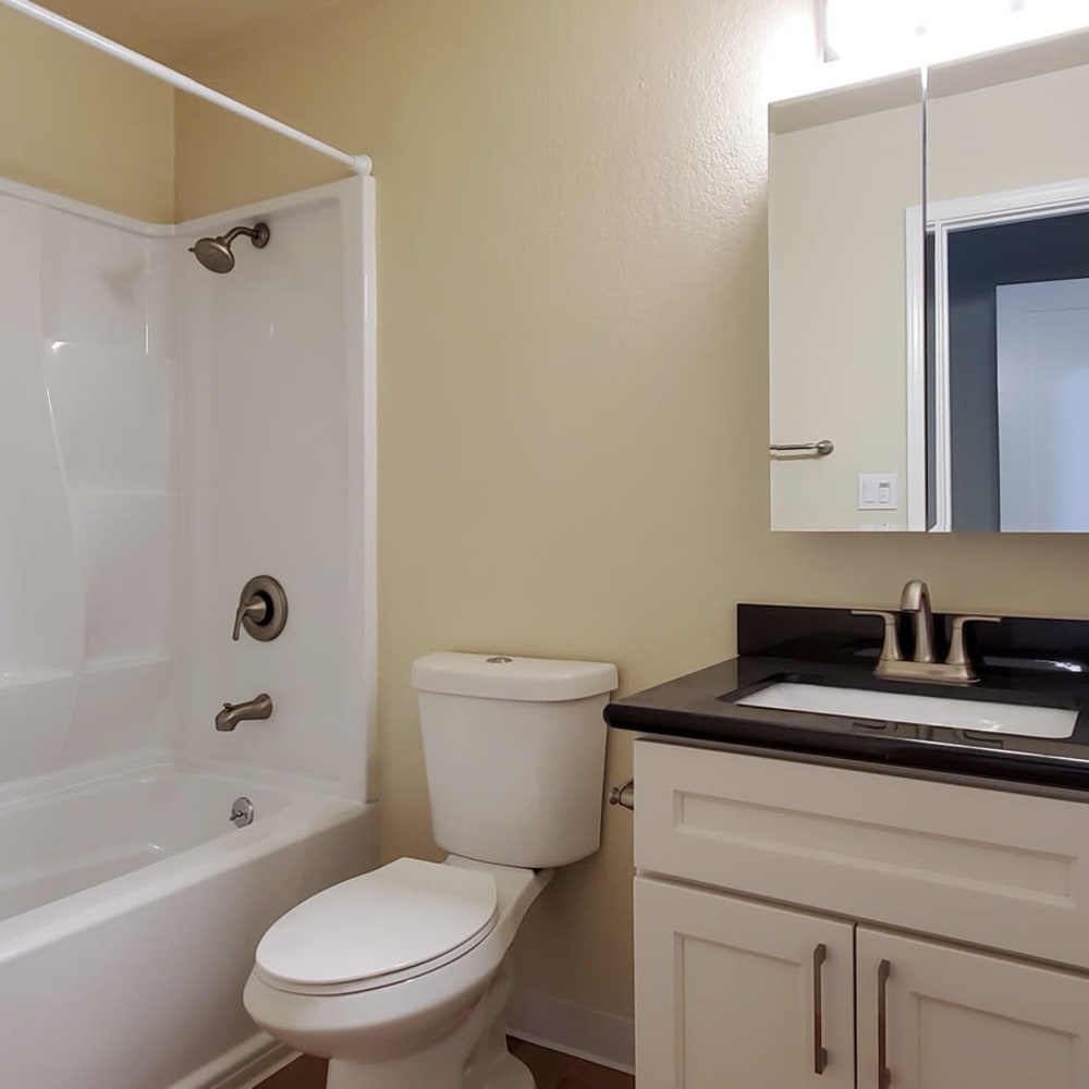 Bathroom with white cabinets and tub/shower at our Ignacio Place community at Mission Rock at Novato in Novato, California