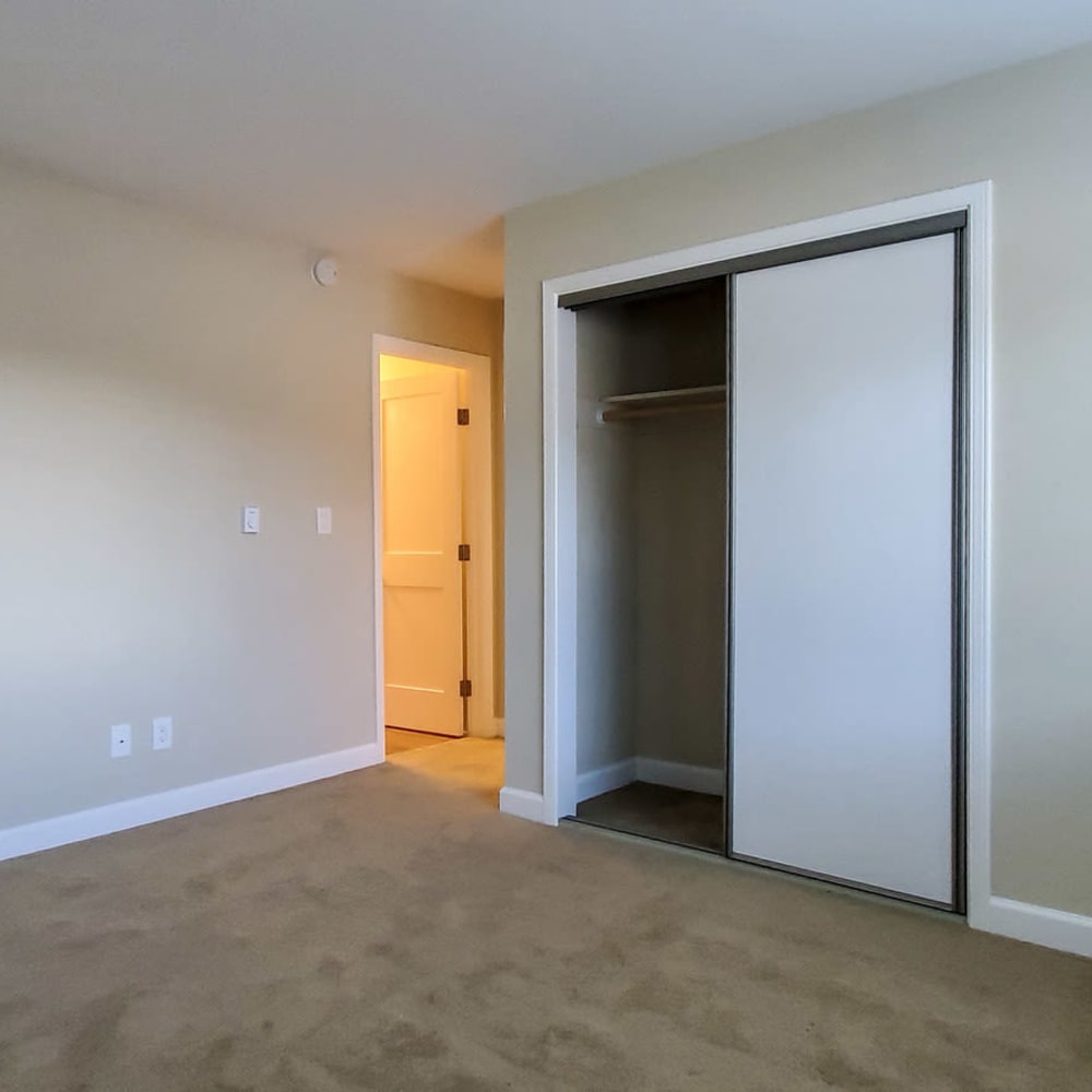 Bedroom with open closet door at our Ignacio Place community at Mission Rock at Novato in Novato, California