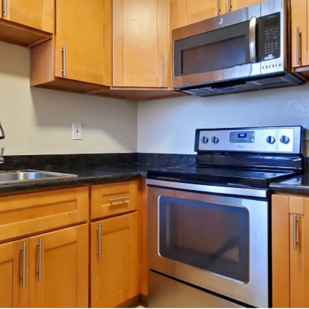 Kitchen with stainless steel appliances in a model home at Mission Rock at Marin in San Rafael, California