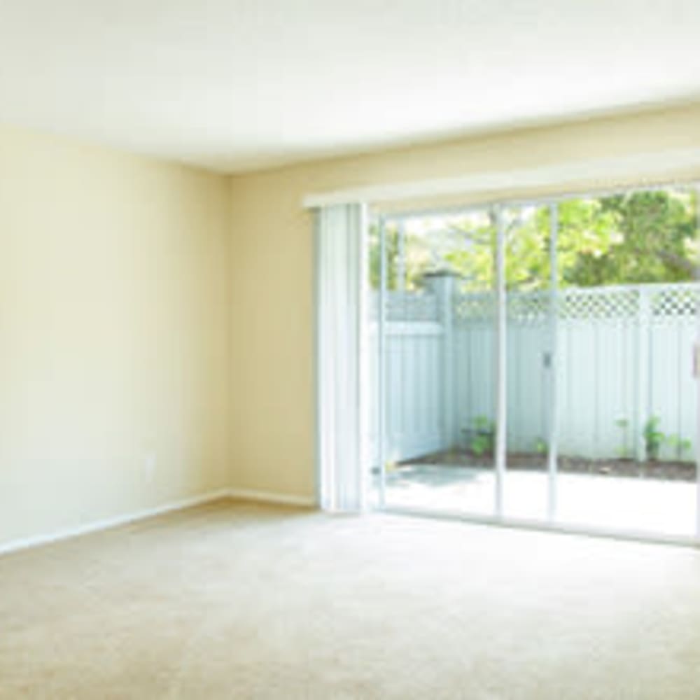 Spacious living room with carpet at Mission Rock at North Bay in Novato, California