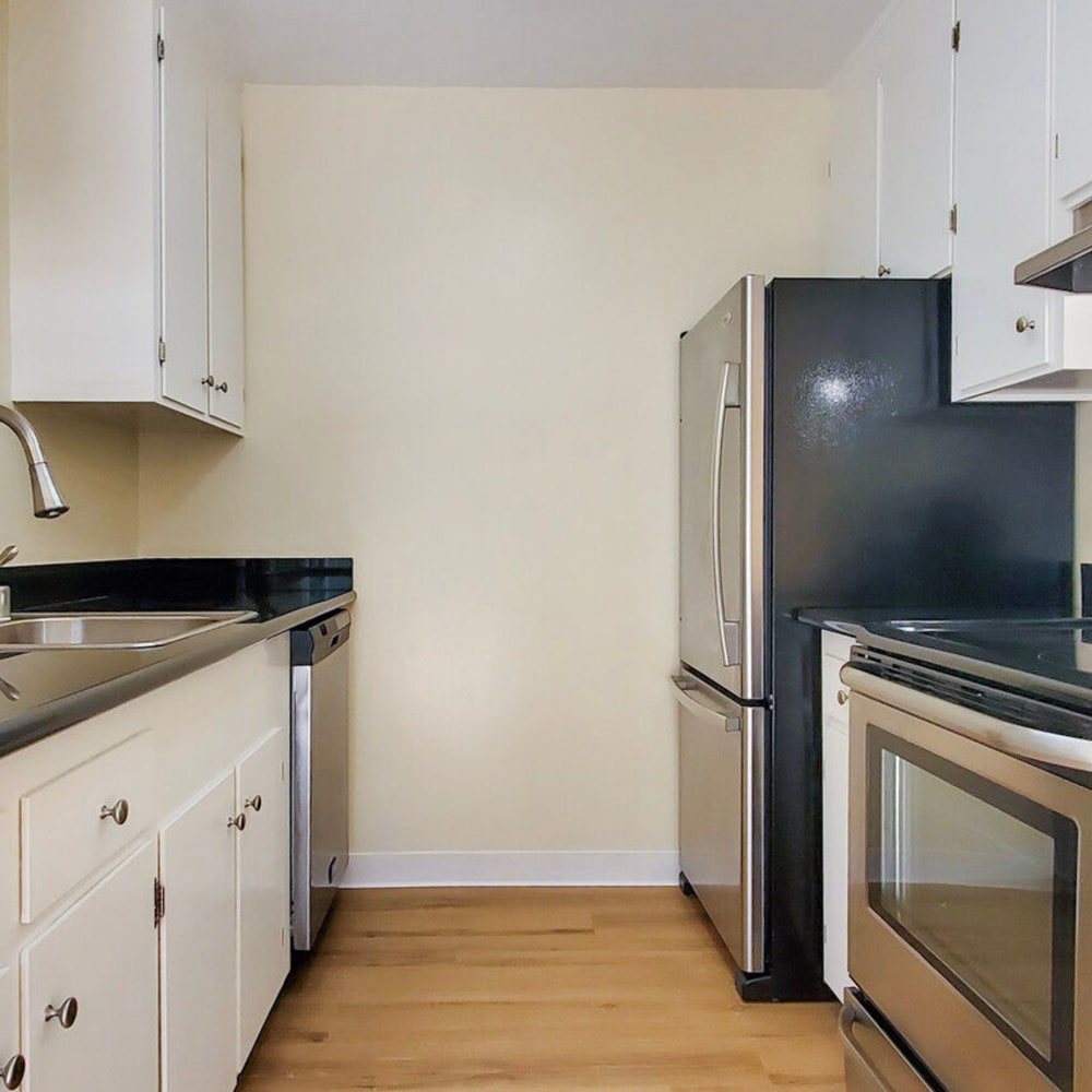 Modern kitchen with stainless-steel appliances in a model apartment home at Mission Rock at San Rafael in San Rafael, California