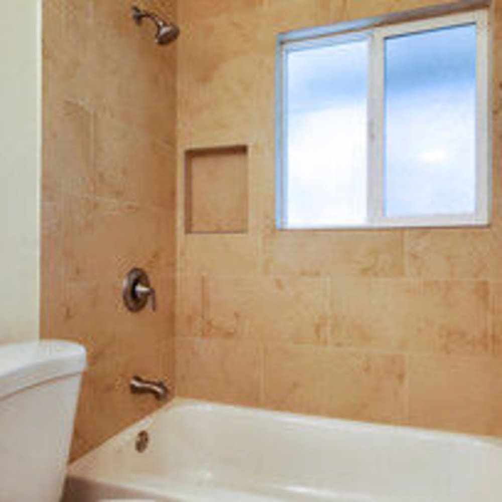 Bathroom with window and tub/shower in a model apartment at our Merrydale View community at Mission Rock at San Rafael in San Rafael, California