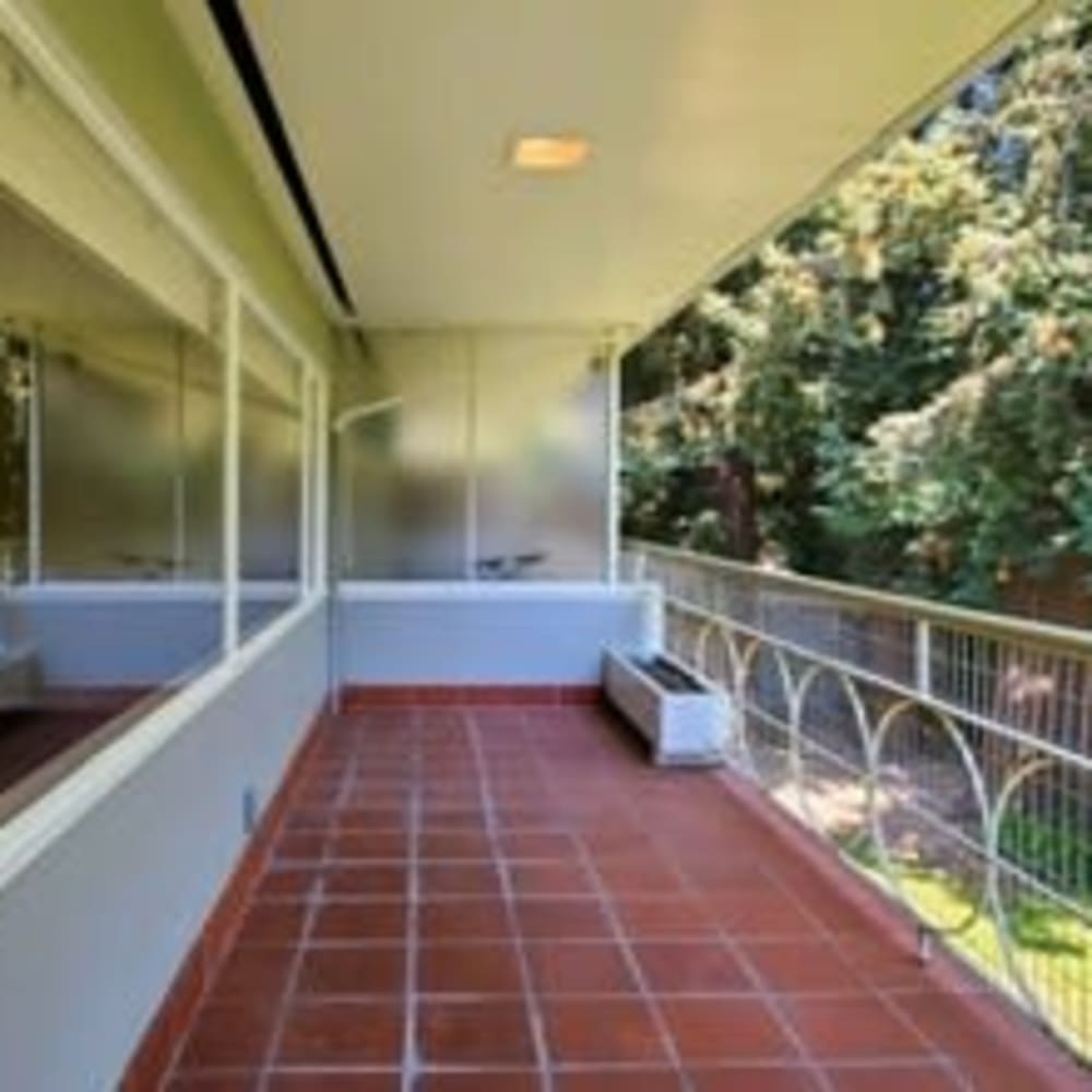 Private tiled patio outside an apartment home at our Glenwood community at Mission Rock at San Rafael in San Rafael, California