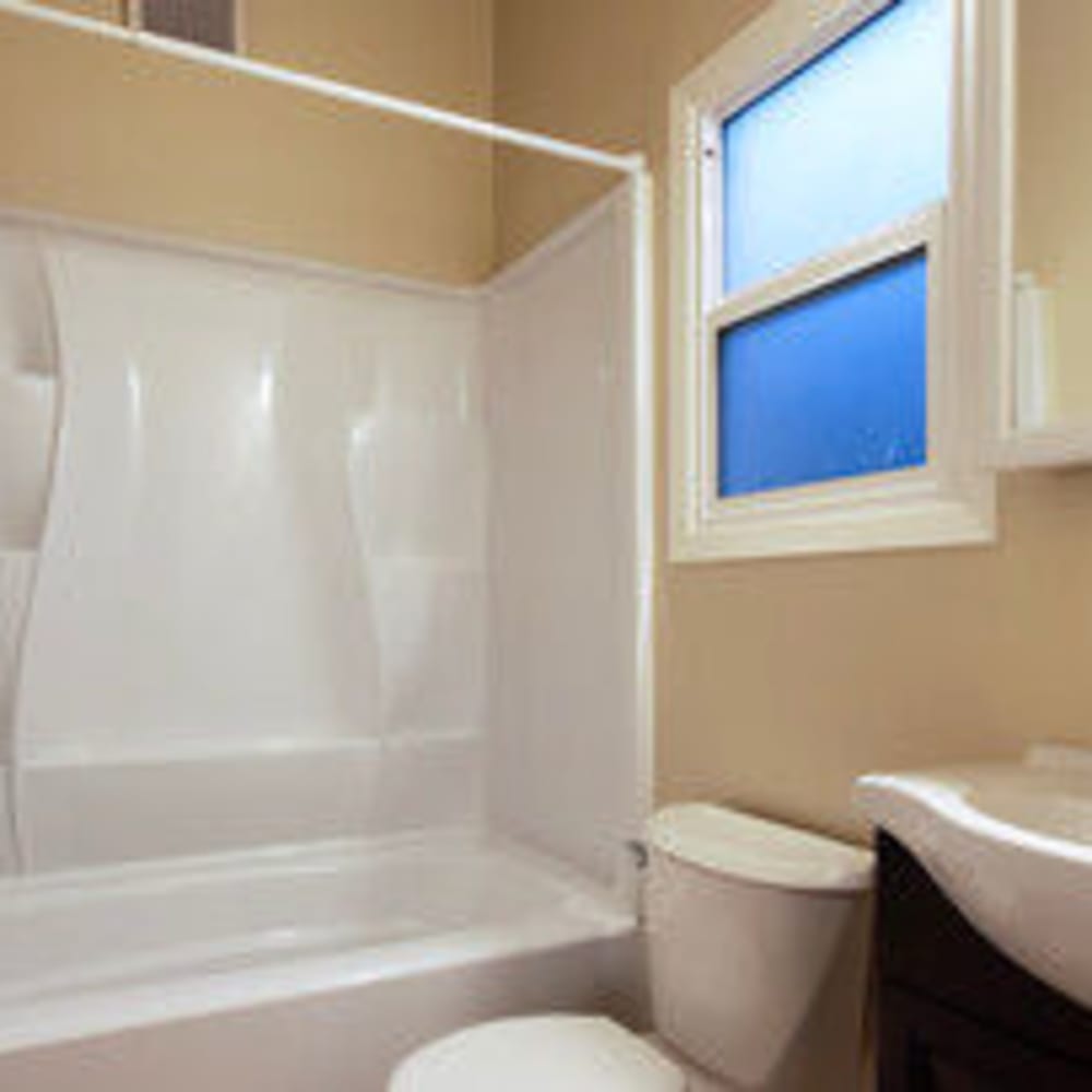 Bathroom with window and tub/shower in an apartment at our Glenwood community at Mission Rock at San Rafael in San Rafael, California