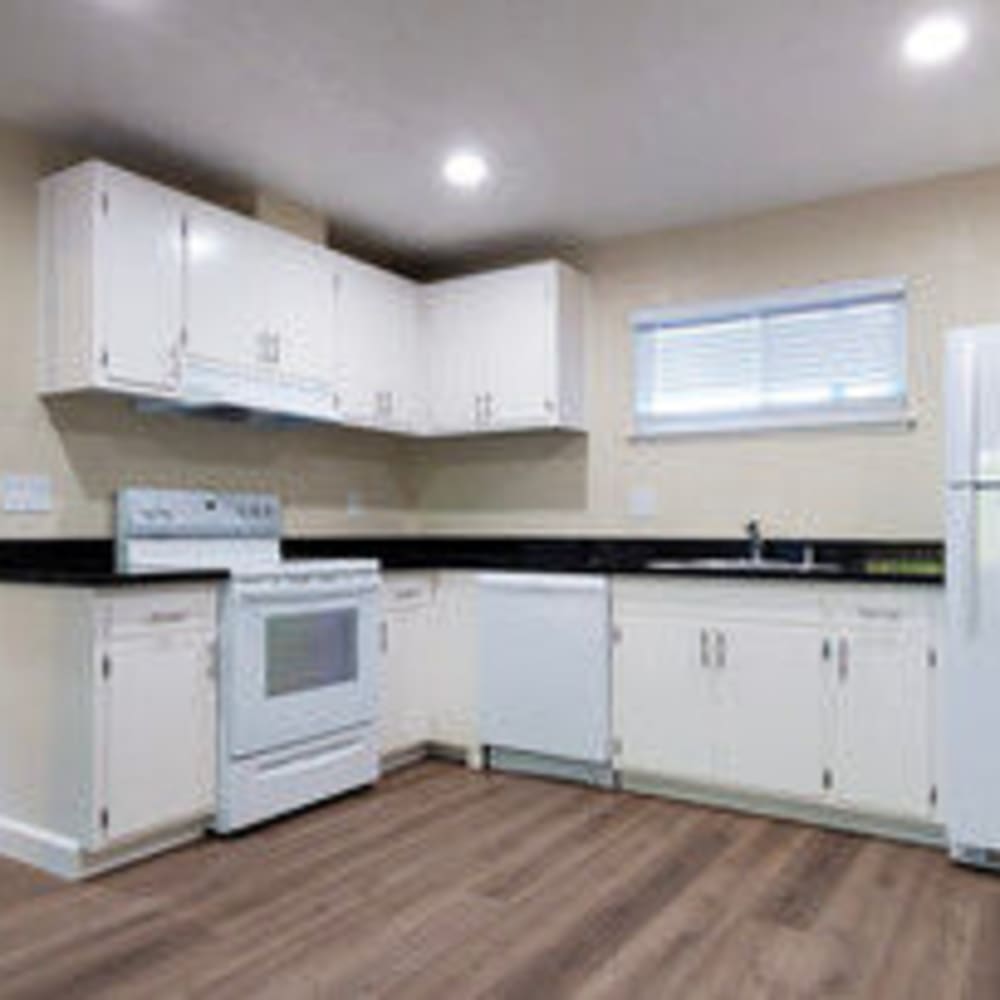 Spacious kitchen with all white appliances at our Marin Heights community at Mission Rock at San Rafael in San Rafael, California