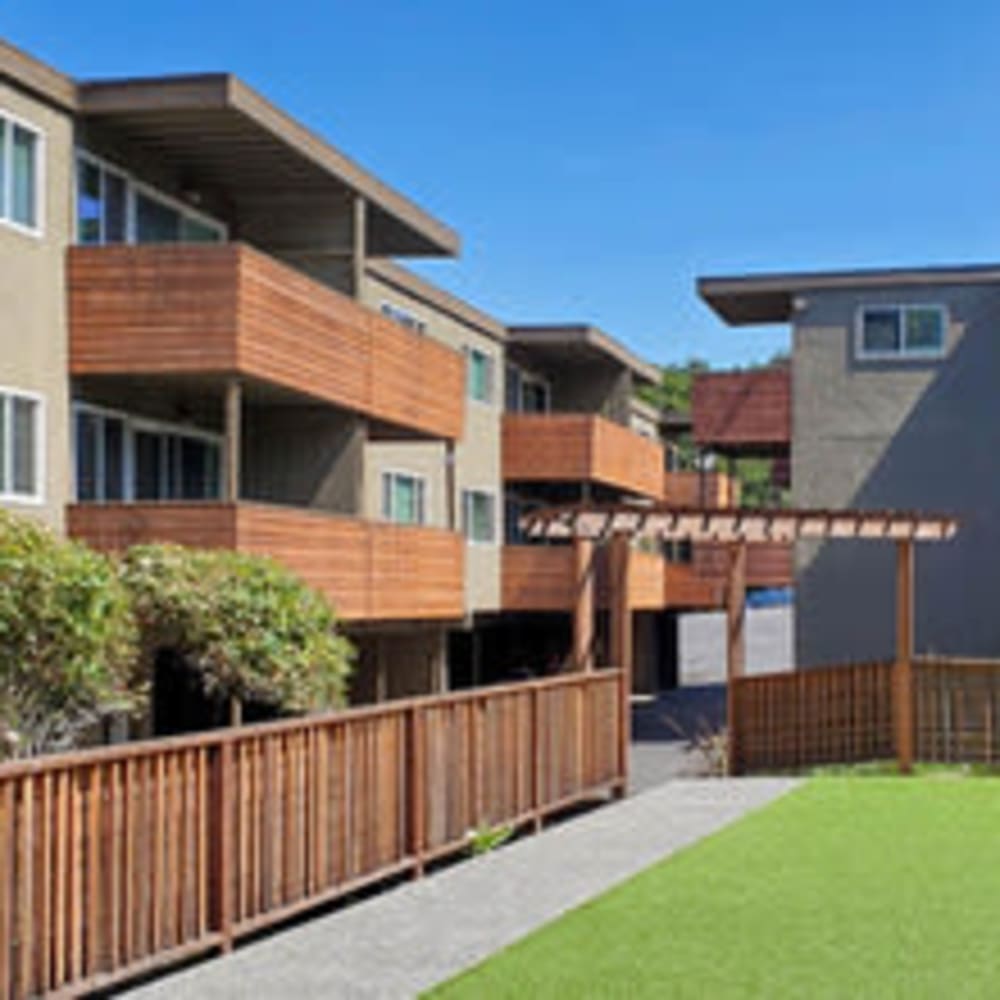 Exterior of community featuring private patios and green space at our Marin Heights community at Mission Rock at San Rafael in San Rafael, California