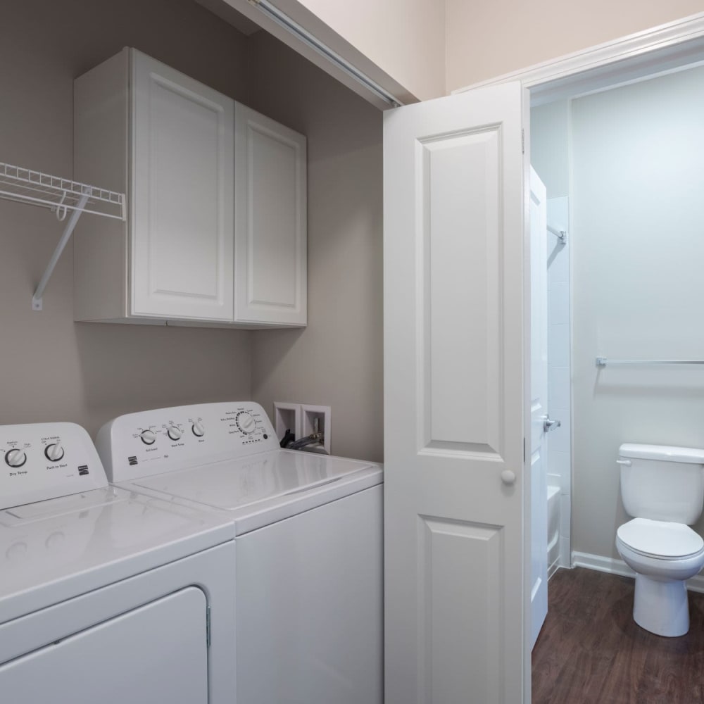 Laundry room at Oaks Centropolis Apartments in Kansas City, Missouri