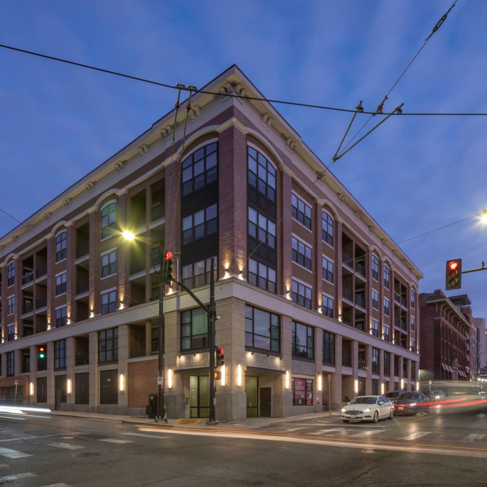 Exterior view at night of the building at Oaks Centropolis Apartments in Kansas City, Missouri