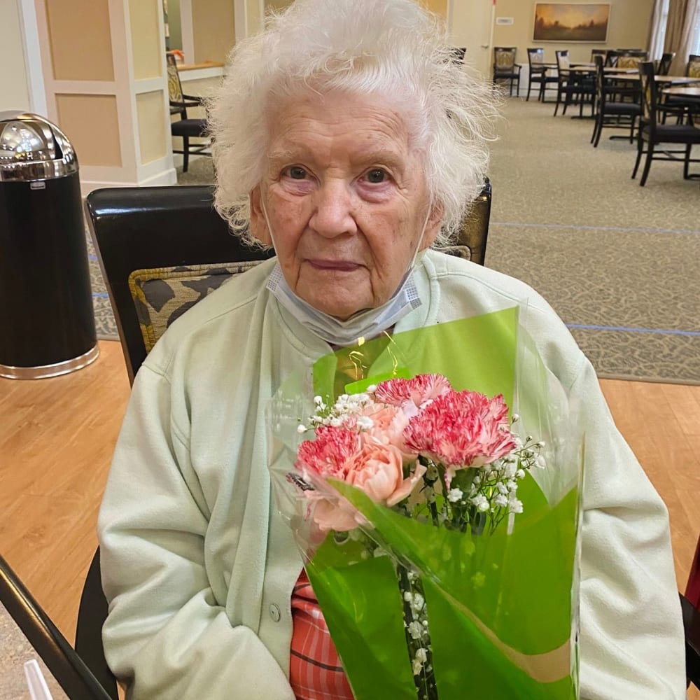 Resident holding flowers at English Meadows Abingdon Campus in Abingdon, Virginia