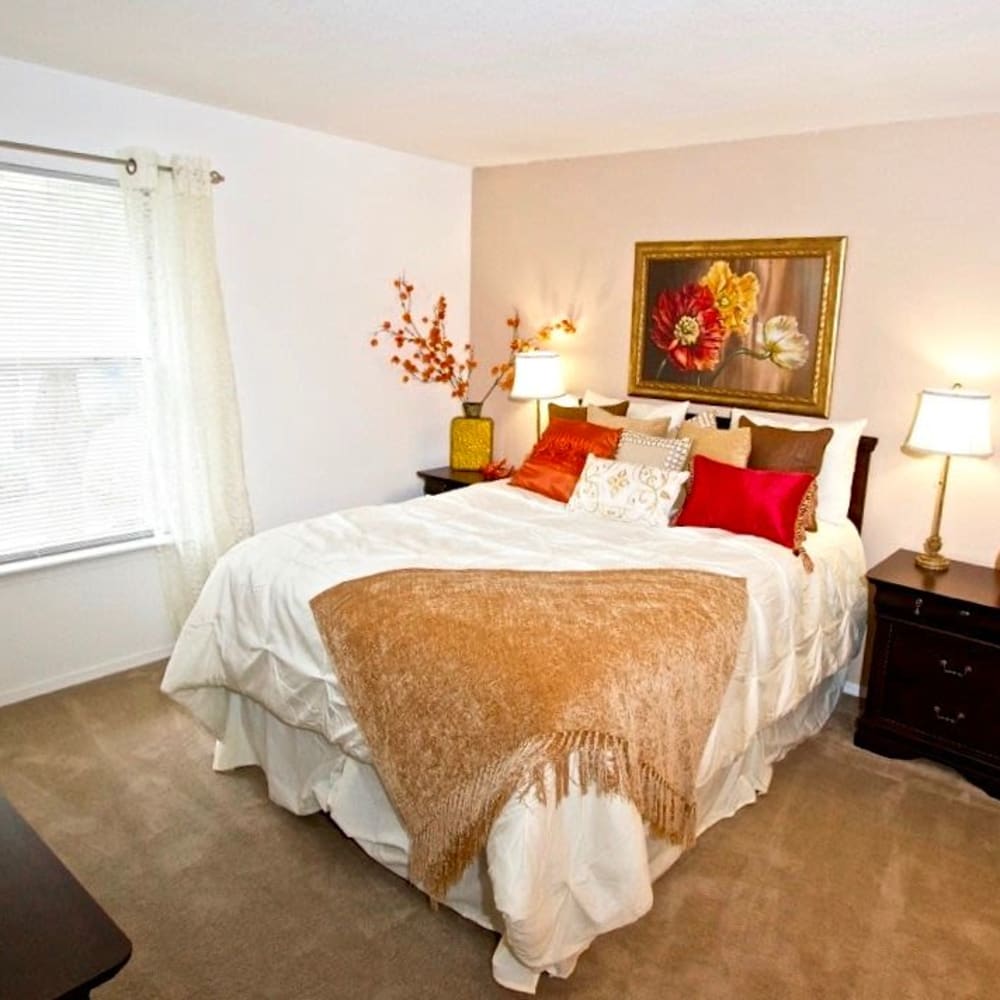  bedroom with throw blanket on the bed at Royal Pointe in Virginia Beach, Virginia