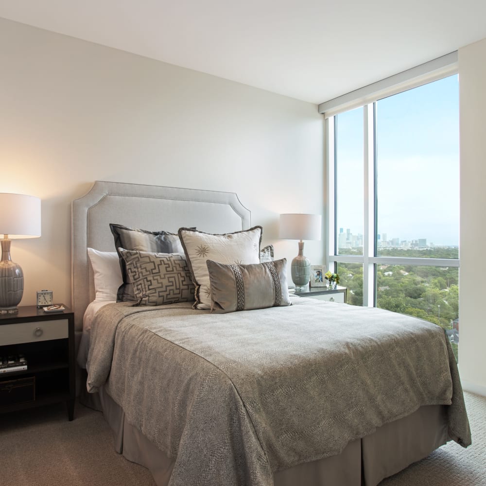 Resident bedroom with plush carpeting at The Village of Southampton in Houston, Texas