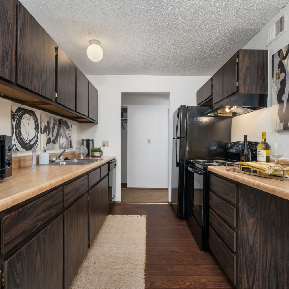 Kitchen with dark cabinetry at The Candles Apartments in Springfield, Illinois