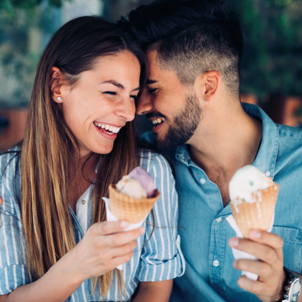 A couple having an ice-cream near Avenues at Shadow Creek Ranch in Pearland, Texas