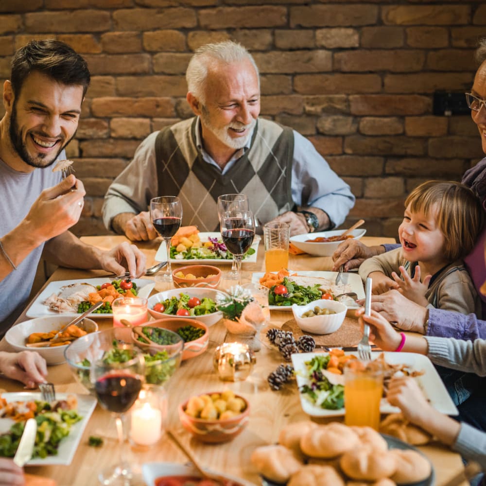 A happy family having  dinner near Discovery at Kingwood in Kingwood, Texas