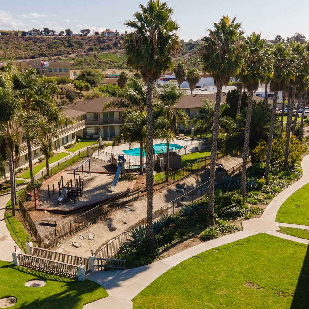 Playground and pool at Stoneybrook Apartments in Oceanside, California