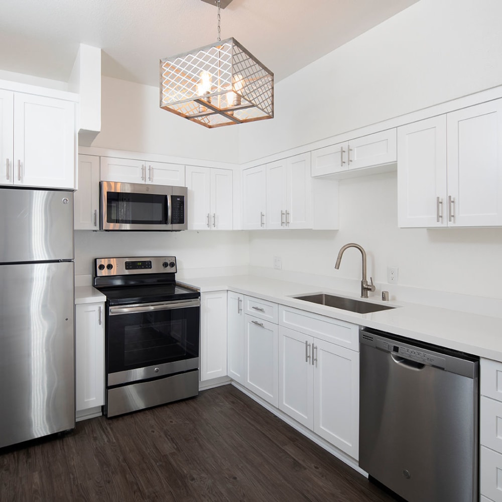 Kitchen with stainless-steel appliances at Greystone Lofts, San Diego, California