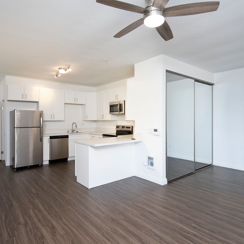 Living room and kitchen at Bridgeview Apartments in San Diego, California