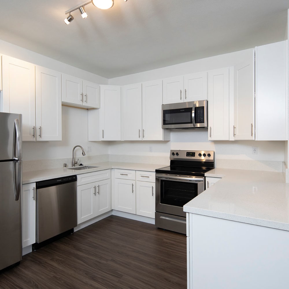 Kitchen with stainless-steel appliances at Bridgeview Apartments, San Diego, California