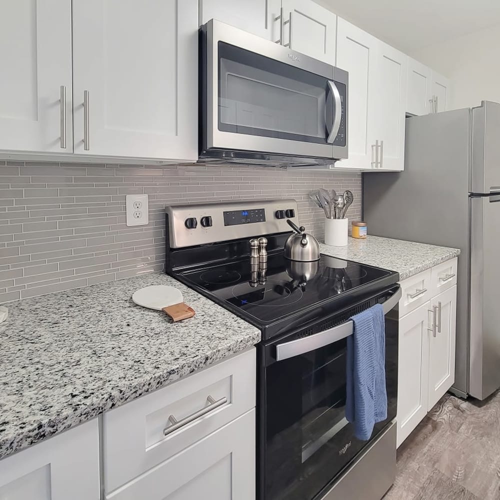 Kitchen with stainless appliance at Squires Manor Apartment Homes in South Park, Pennsylvania