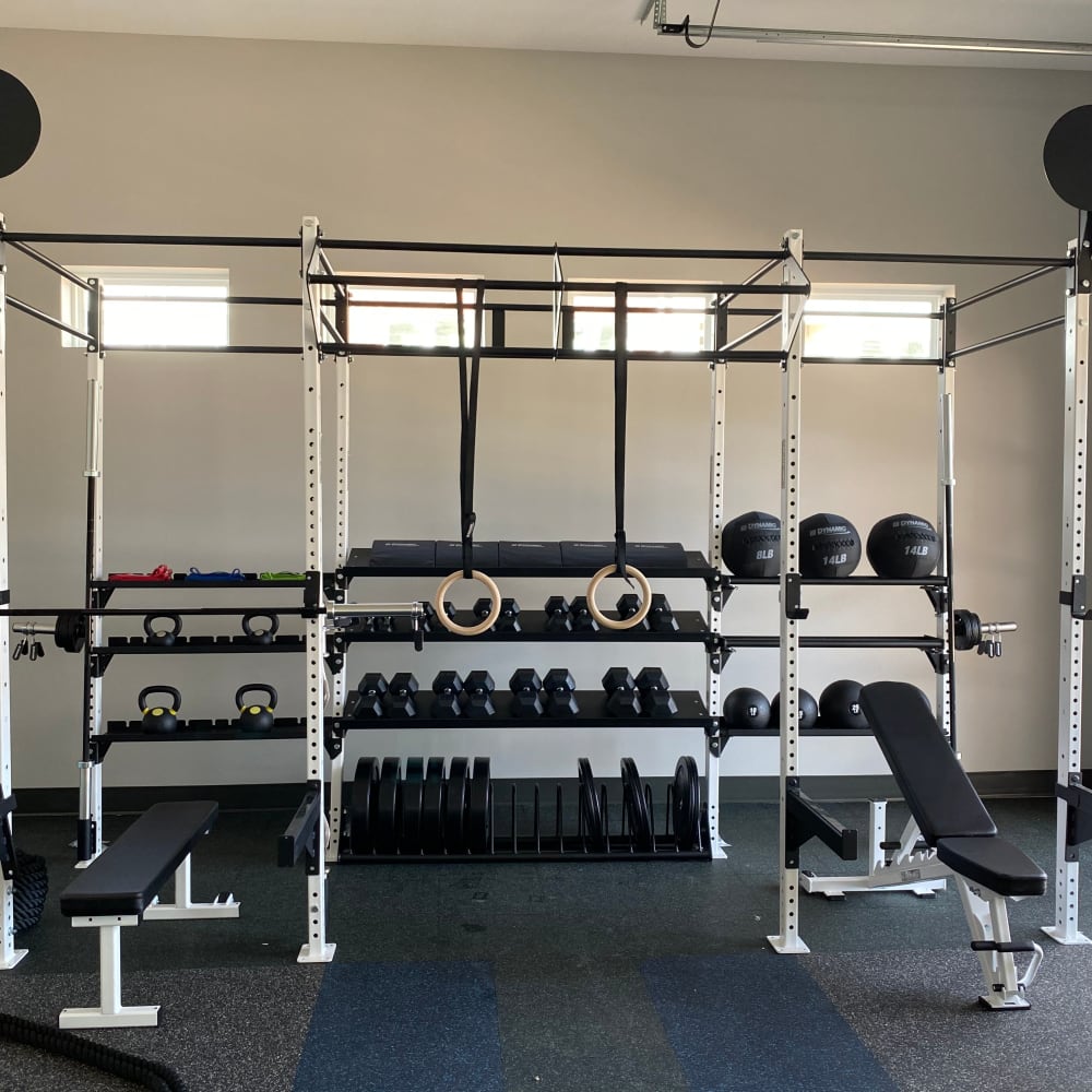 Fitness center with weights at Center West Apartments in Midlothian, Virginia