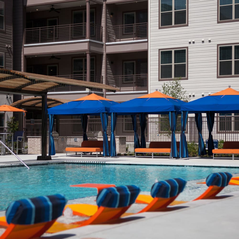 Lounge area by the pool at Alma Hub 121 in McKinney, Texas
