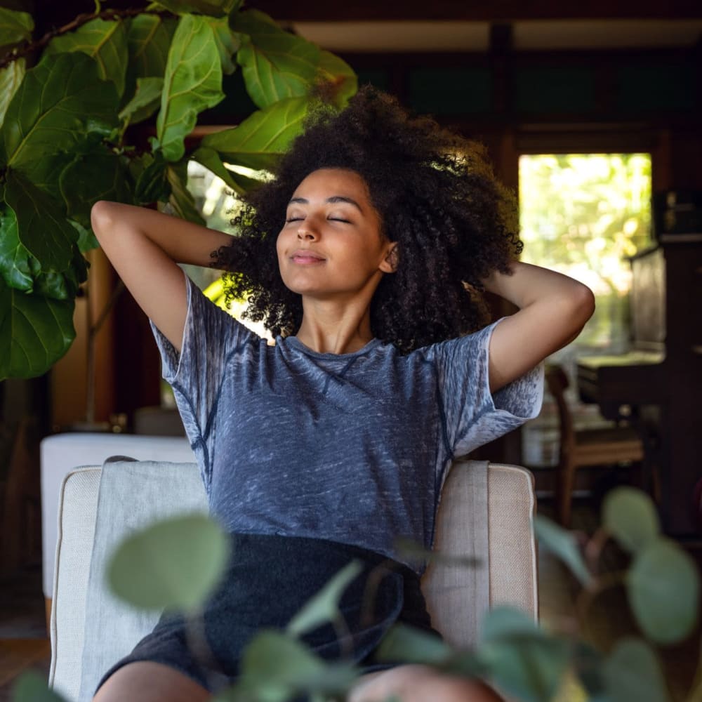 Woman relaxing at Alma Hub 121 in McKinney, Texas