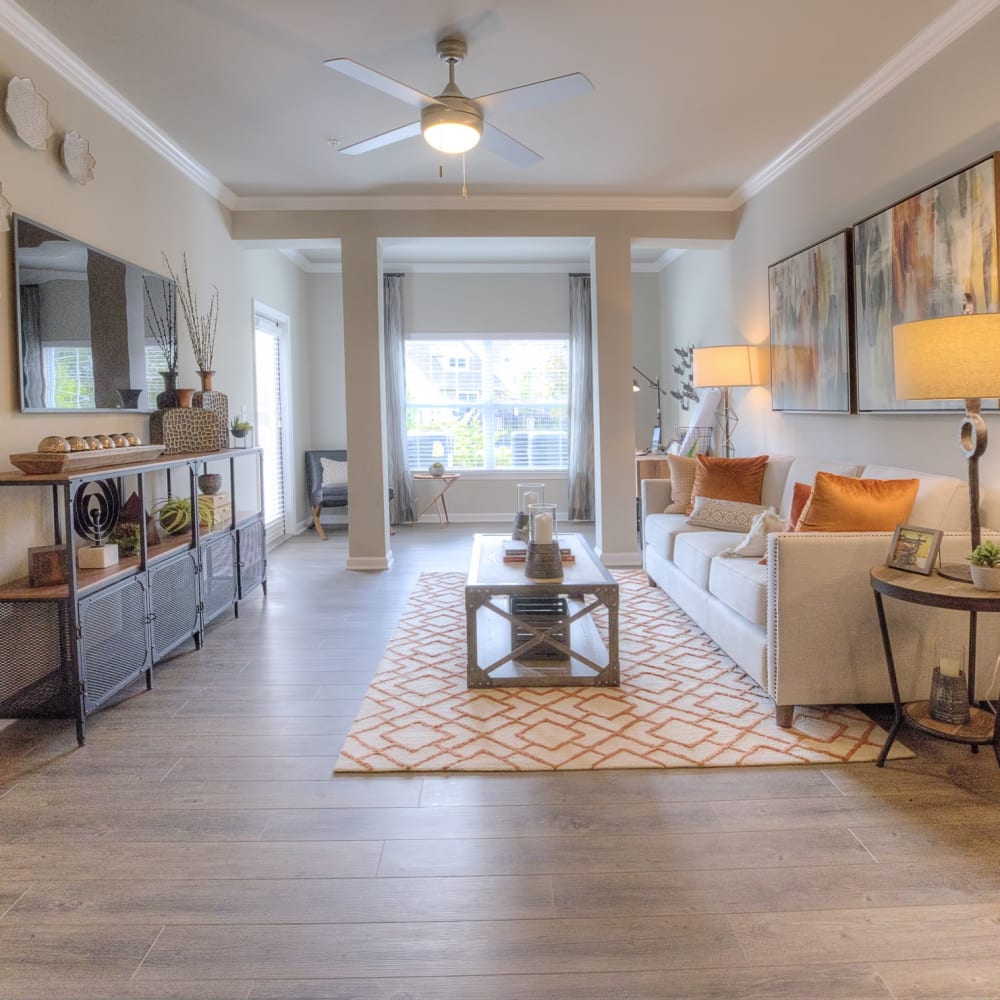 Wood flooring in a furnished apartment living room at Lullwater at Blair Stone in Tallahassee, Florida