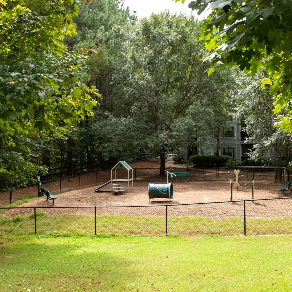 A fenced in community dog park at Heritage at Riverstone in Canton, Georgia