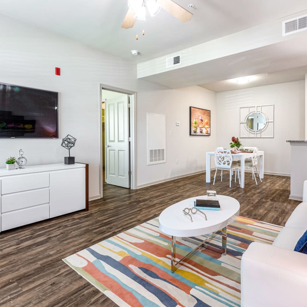 Wood flooring in a furnished apartment living room and dining room at Reagan Crossing in Covington, Louisiana