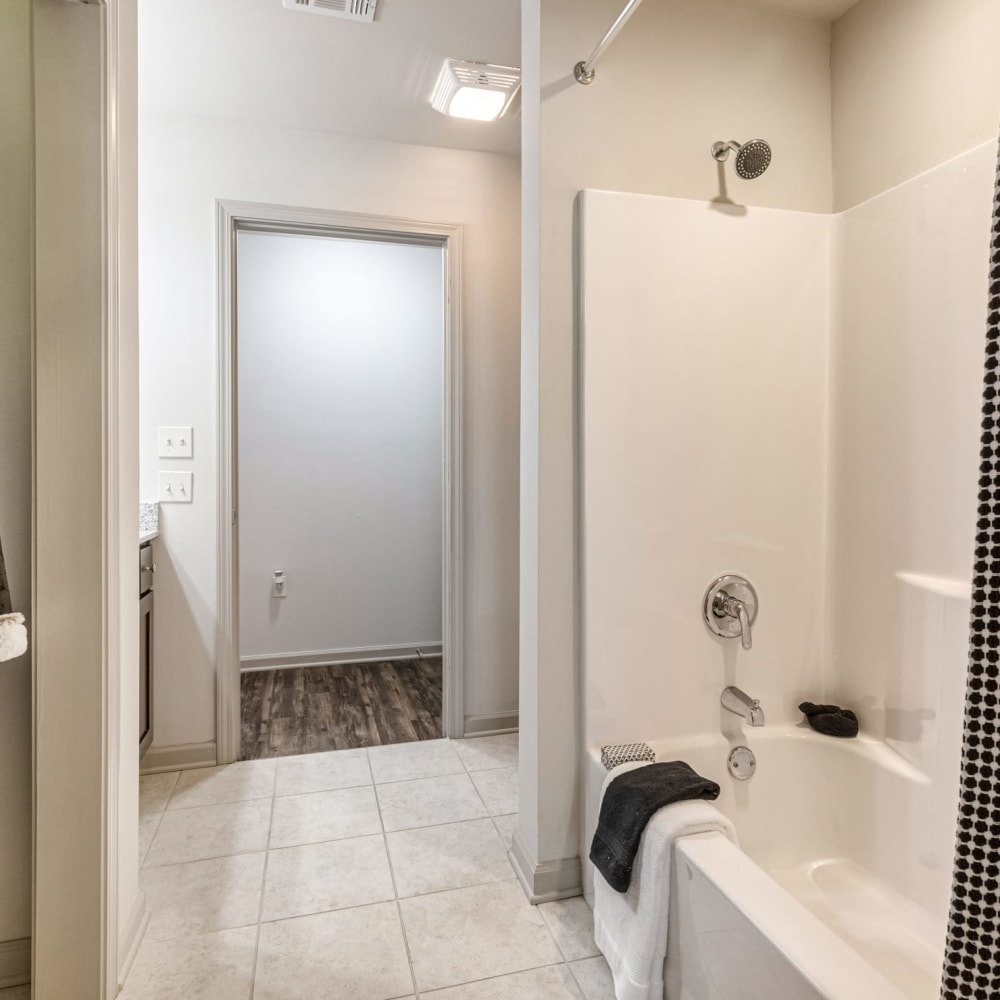 An inviting bathtub in an apartment bathroom at Reagan Crossing in Covington, Louisiana