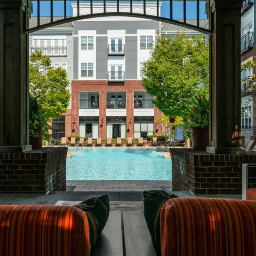Covered seating by the community pool at Residences at Congressional Village in Rockville, Maryland