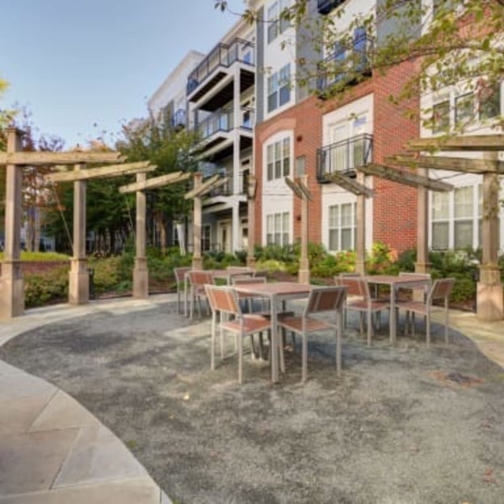 Outdoor tables and chairs for residents at Residences at Congressional Village in Rockville, Maryland