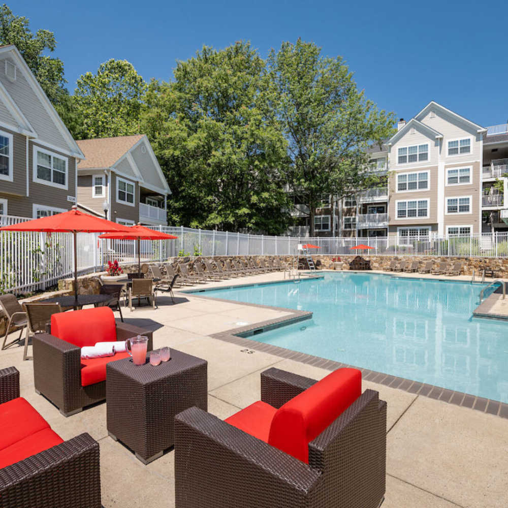 Sparkling saltwater swimming pool and sitting chairs at The Elms at Oakton in Fairfax, Virginia