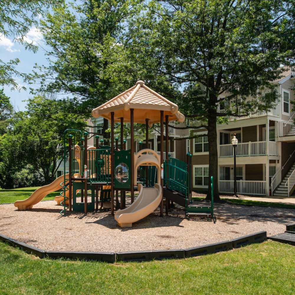 Kids playground with slides at The Elms at Oakton in Fairfax, Virginia