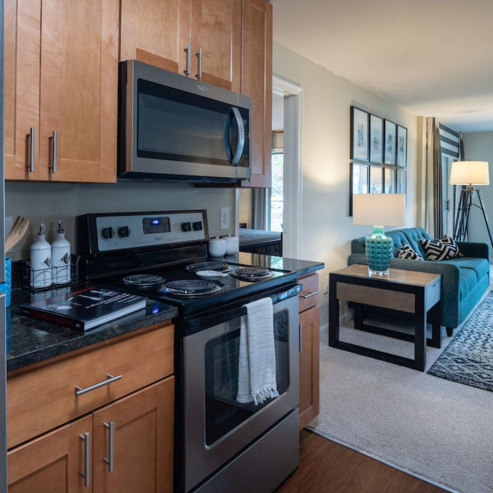 A modern kitchen with stainless steel appliance at The Elms at Oakton in Fairfax, Virginia