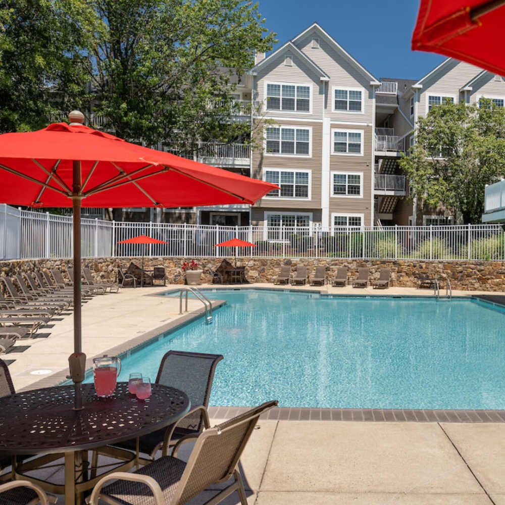 Swimming pool with sitting chairs and table at The Elms at Oakton in Fairfax, Virginia