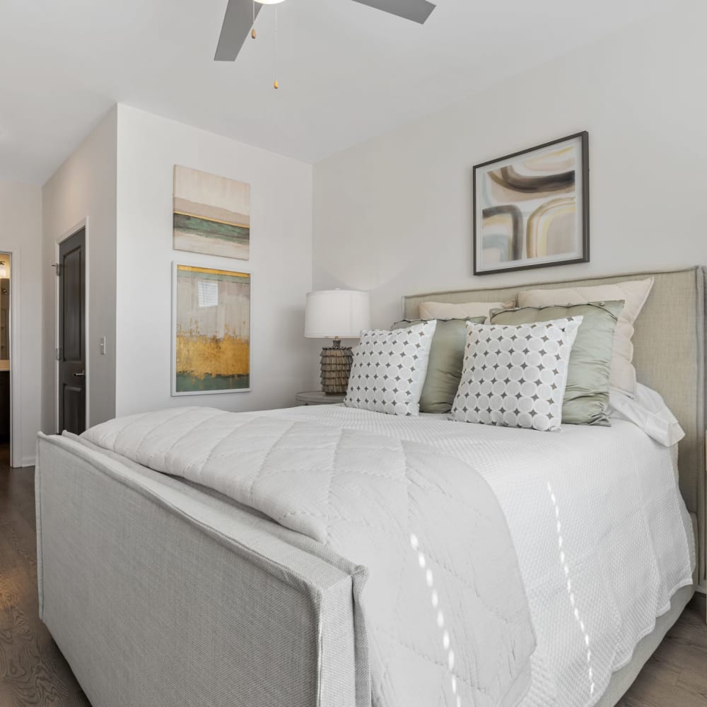 A large bed in an apartment bedroom at The Station at Clift Farm in Madison, Alabama