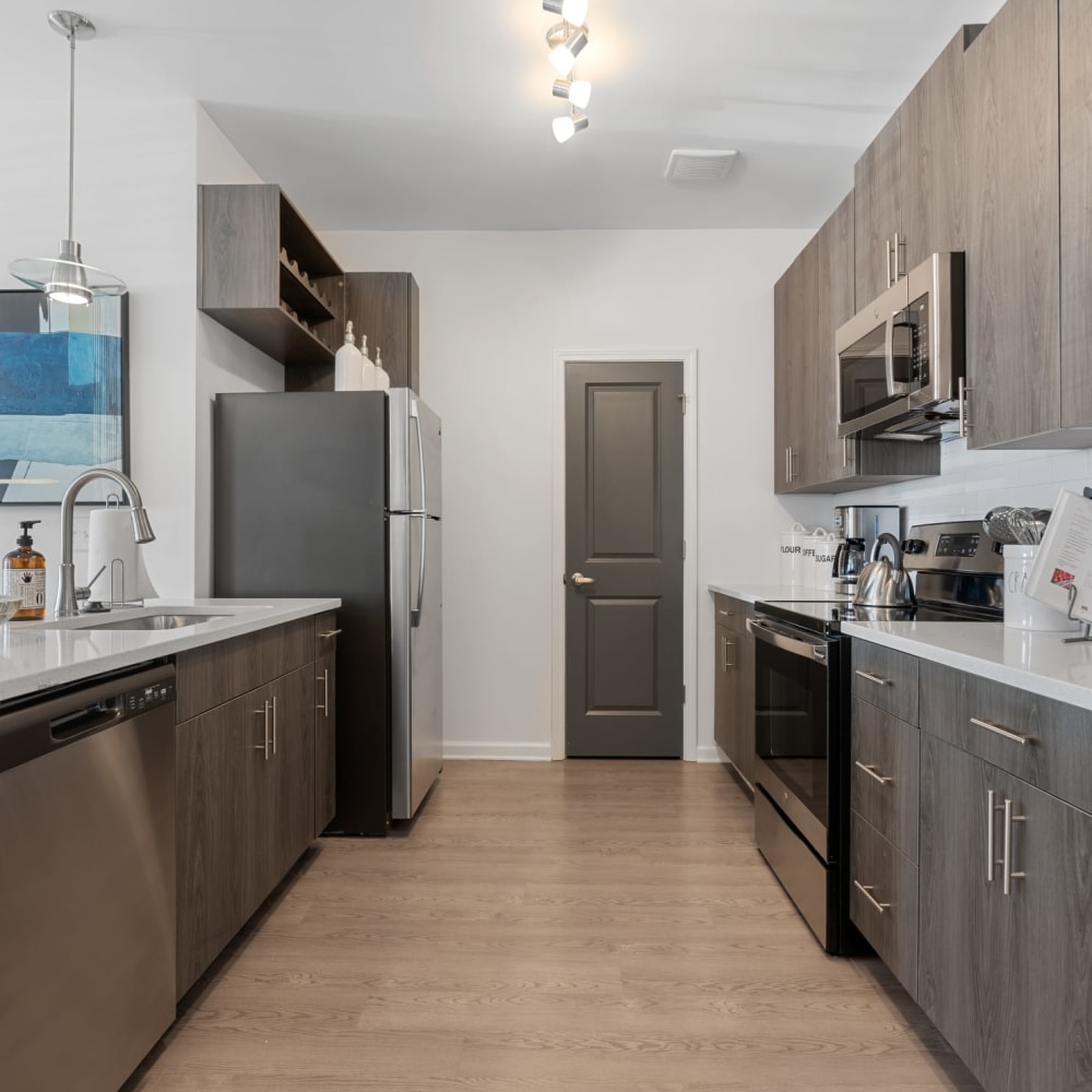 Stainless steel appliances in an apartment kitchen at The Station at Clift Farm in Madison, Alabama