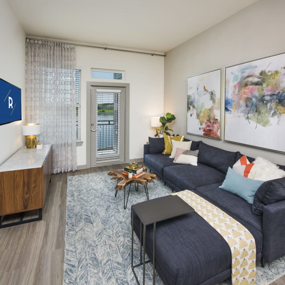 Wood flooring in a furnished apartment living room at Ravella at Town Center in Jacksonville, Florida